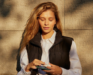 Woman enjoying music with a authentic AirPod replacement